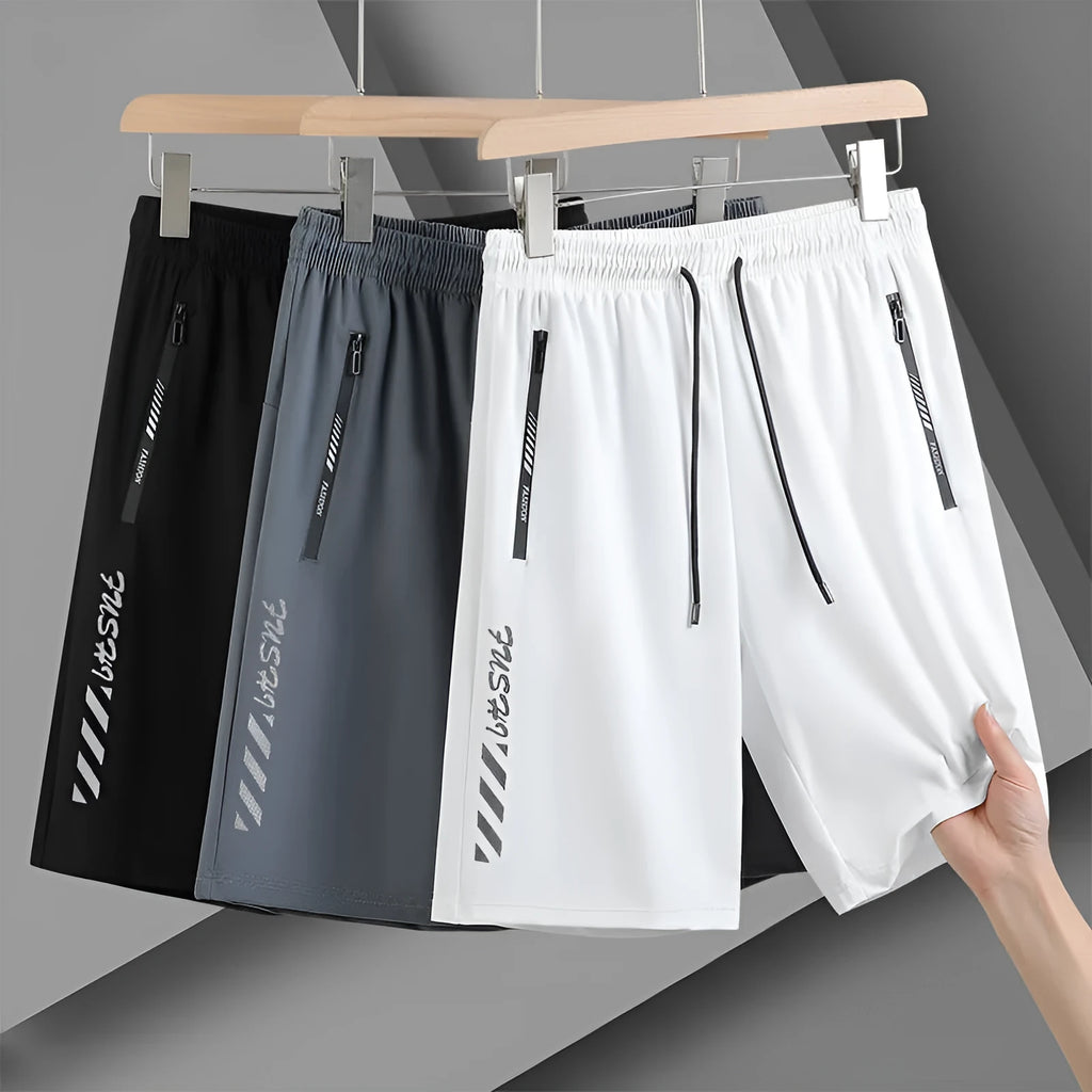 Men's black loose-fit quick-dry nylon sports shorts with elastic waistband.