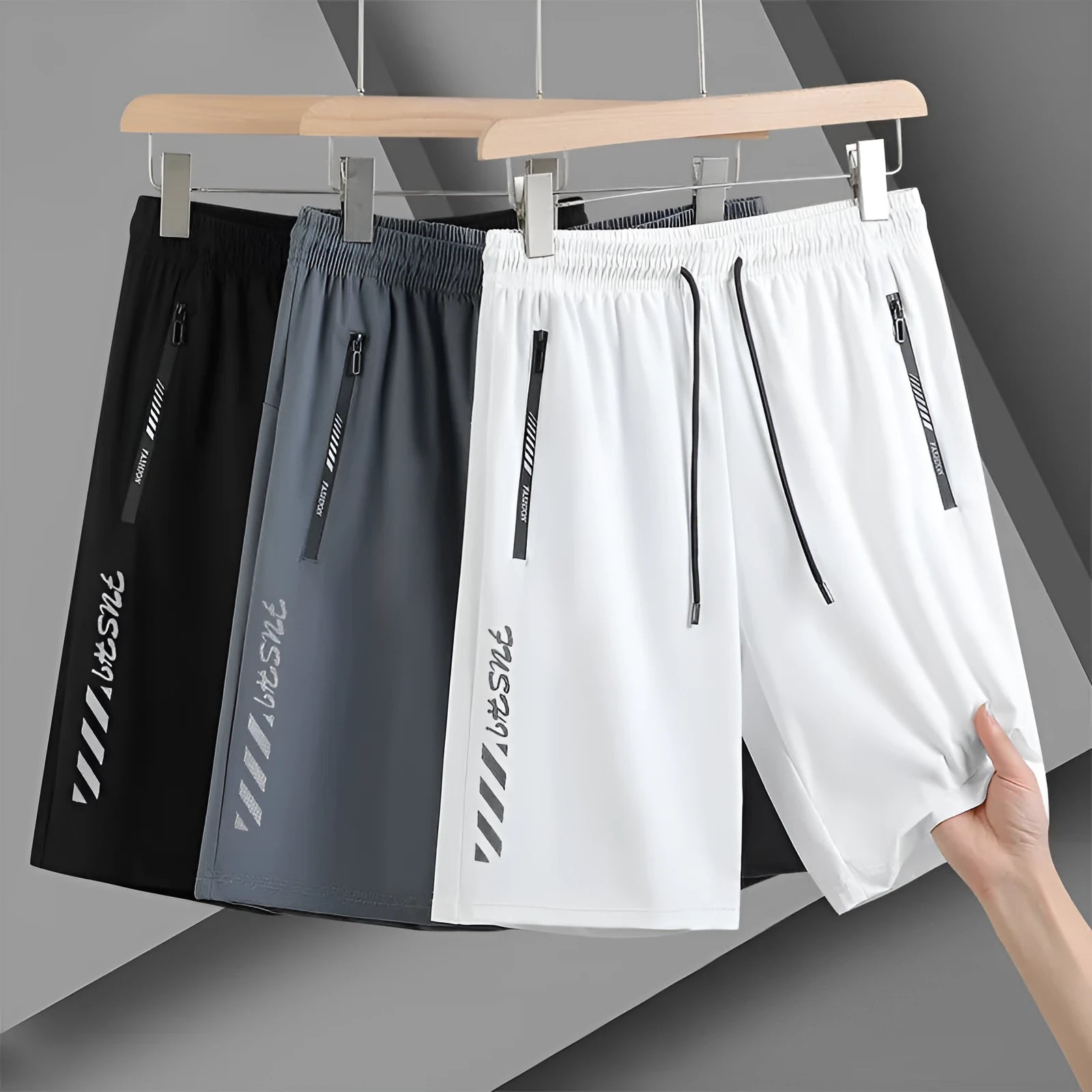 Men's black loose-fit quick-dry nylon sports shorts with elastic waistband.