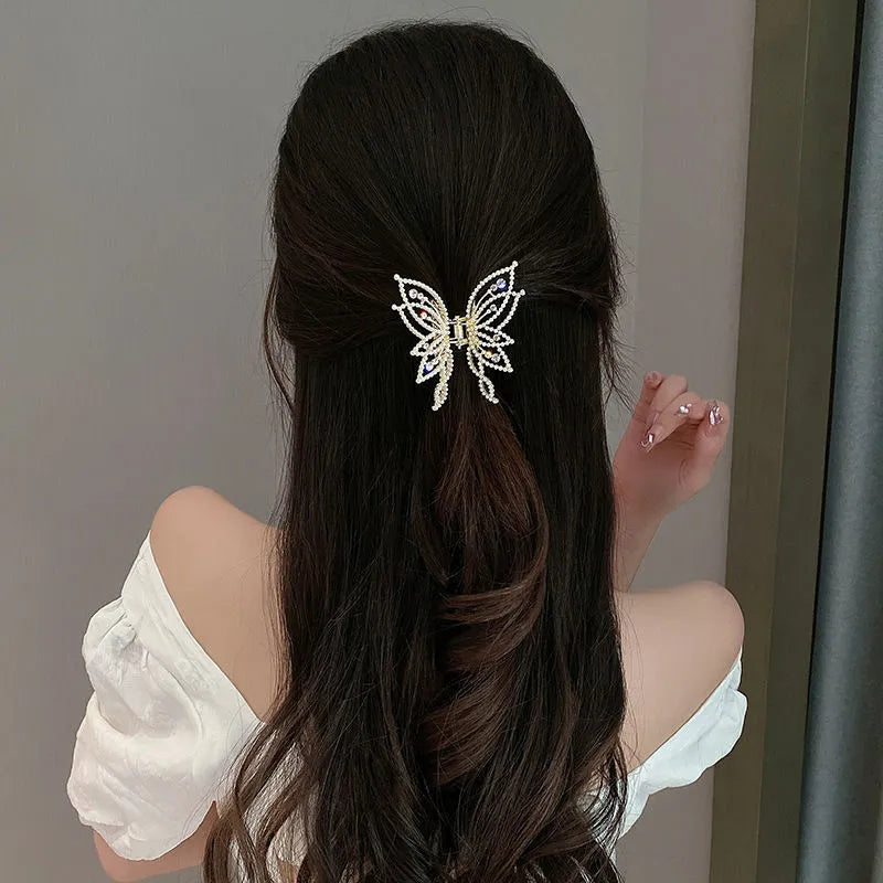 Butterfly design alloy hair barrette with electroplated finish measuring 6.7x6.2cm