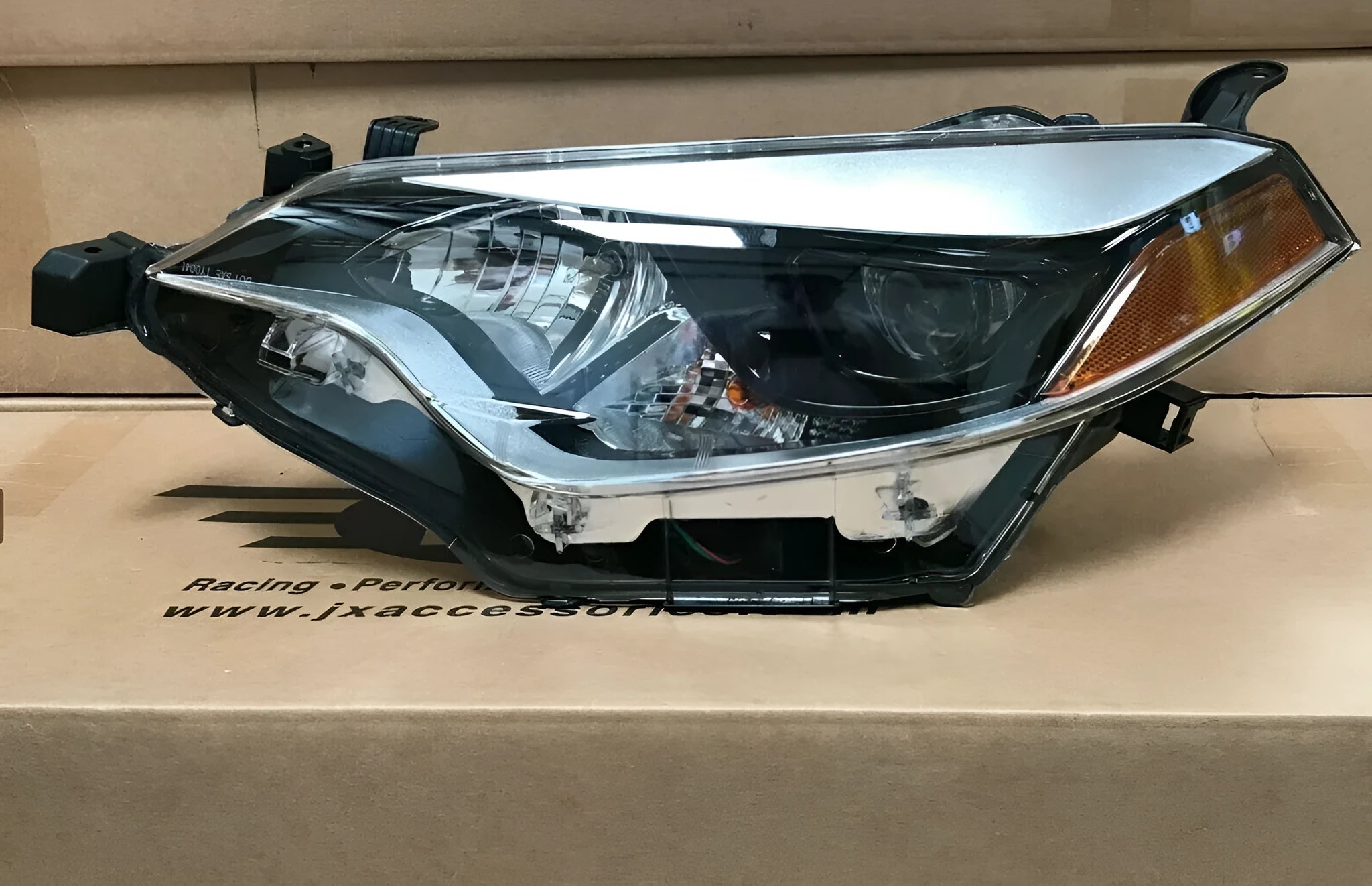 Halogen headlight assembly for a 2014-2015 Toyota Corolla, part number 8111002E60.