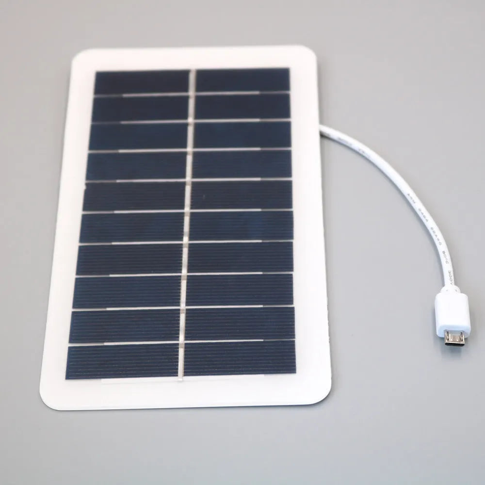 Black portable solar panel charger with USB port for mobile phone charging