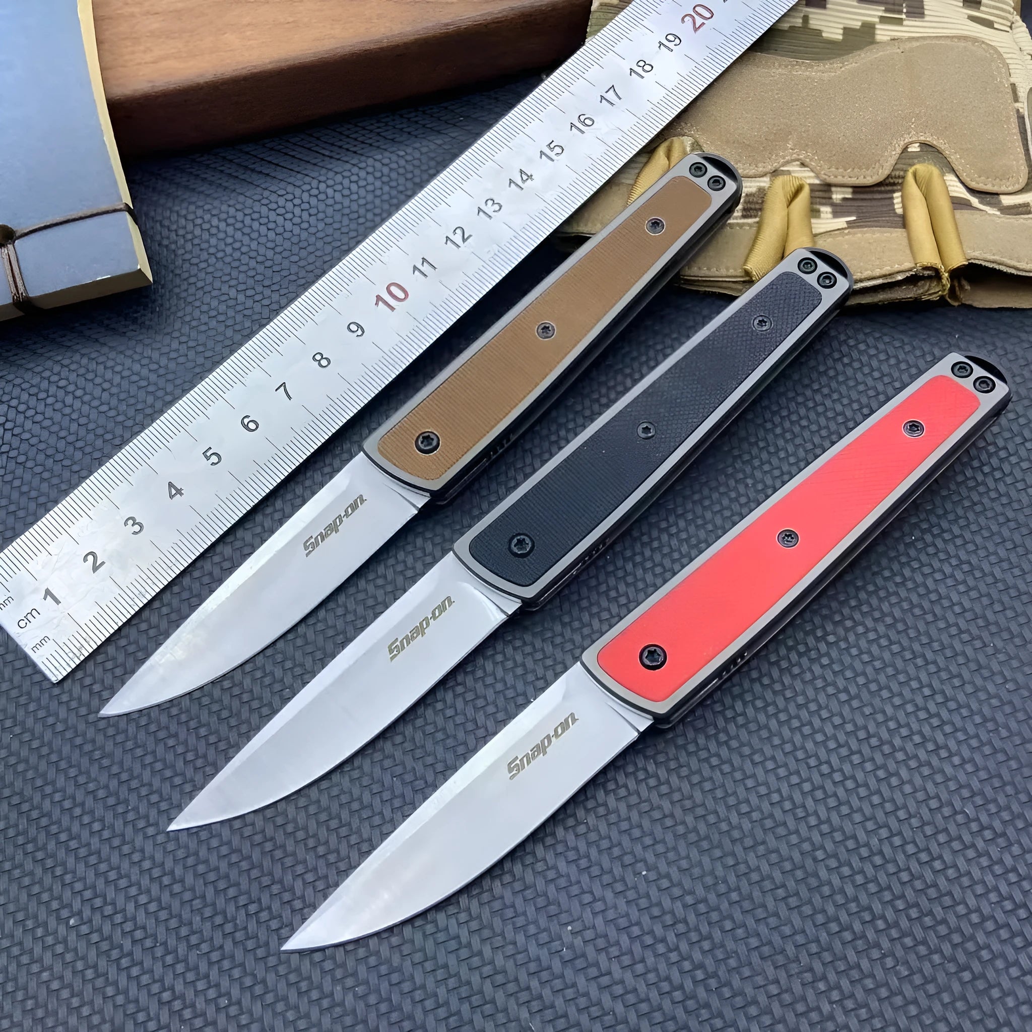 Folding fruit knife with stainless steel blade in black, brown, or red with measurements showing 17cm length