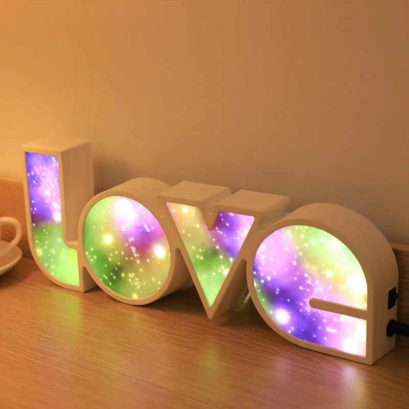 Rainbow halo style LED LOVE decorative light measuring 35.5cm wide