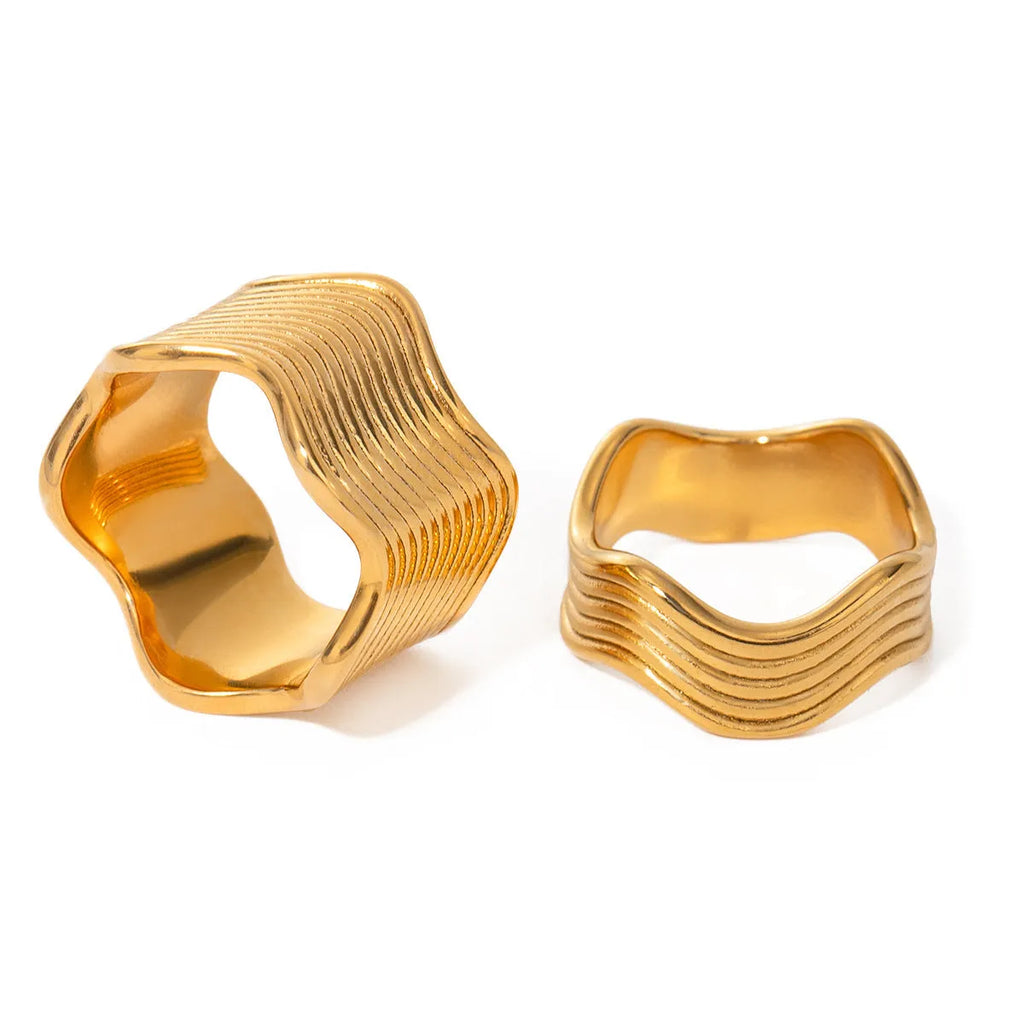 Stainless steel geometric wave ring for women in silver or gold finish.