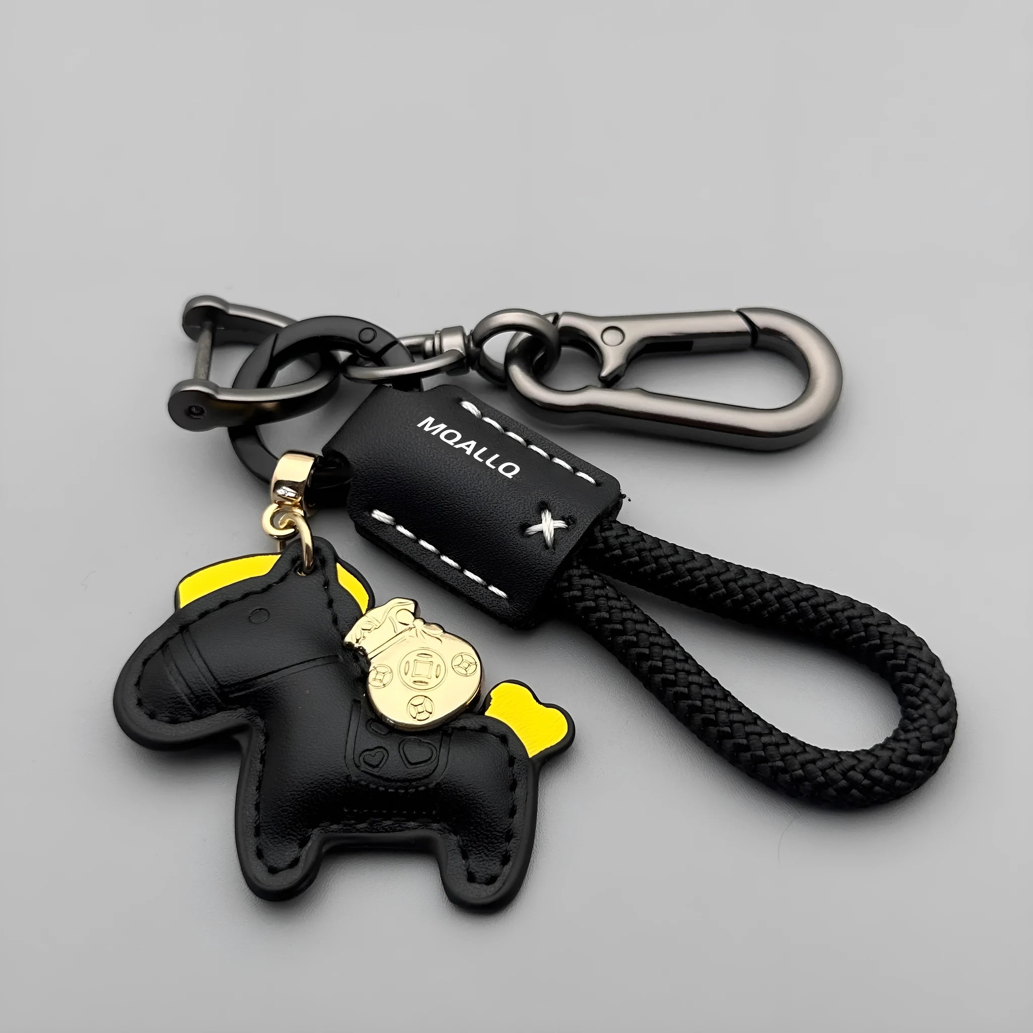 Handmade brown cowhide leather keychain with a silver pony belt buckle charm and green velvet rope.