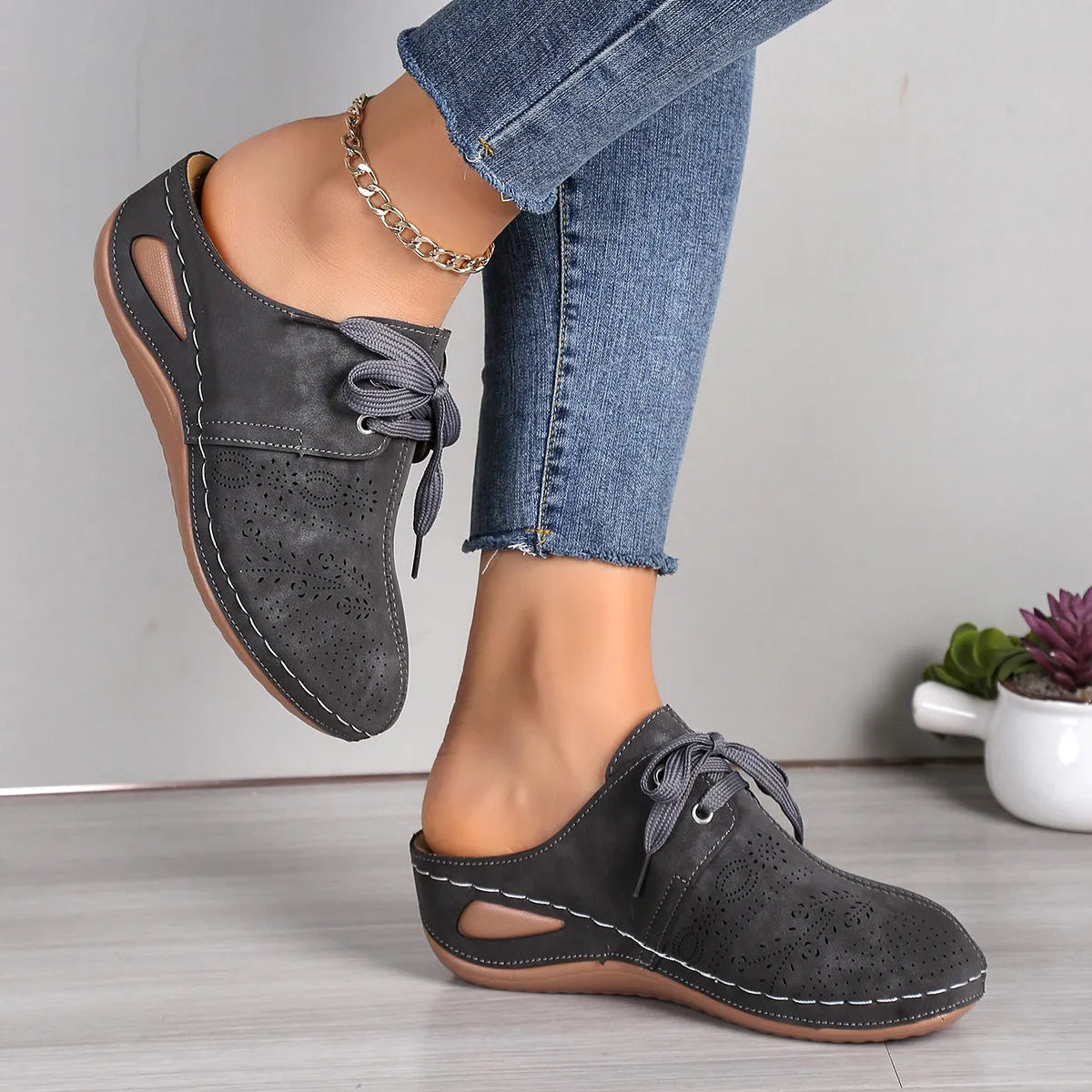 Women's black baotou lace-up slippers with hollow out wedge and suede upper on a rubber sole