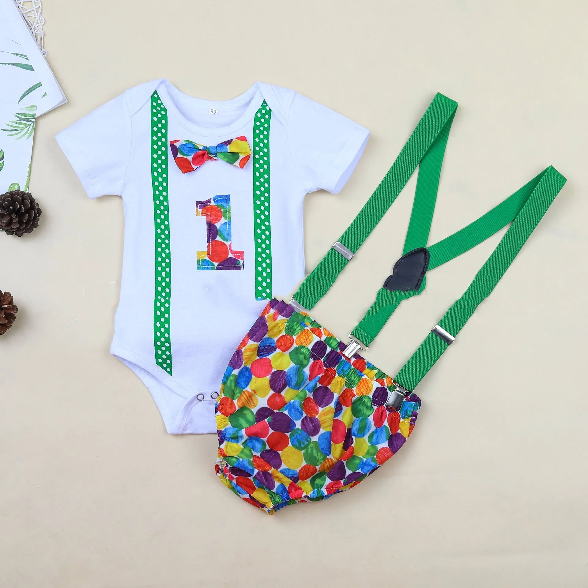 Cotton baby romper set with dinosaur print in blue or green, shorts length with ruffles and straps