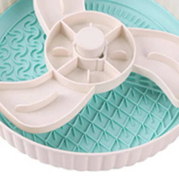 Interactive pet slow feeder bowl with rotating game board and textured silicone pad in assorted colours.