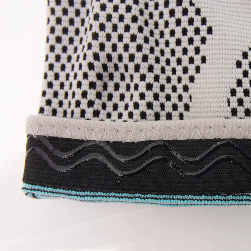 Sky blue elastic fibre knee pad with silicone grip for sports, shown in S, M, L, XL sizes.