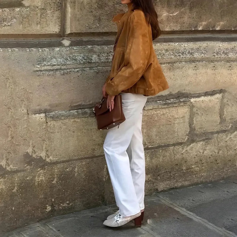 A loose-fitting solid colour long sleeve jacket on a white background.