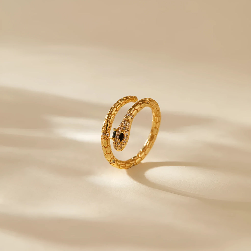Copper snake ring with adjustable opening and gold colour plating, showing open mouth design