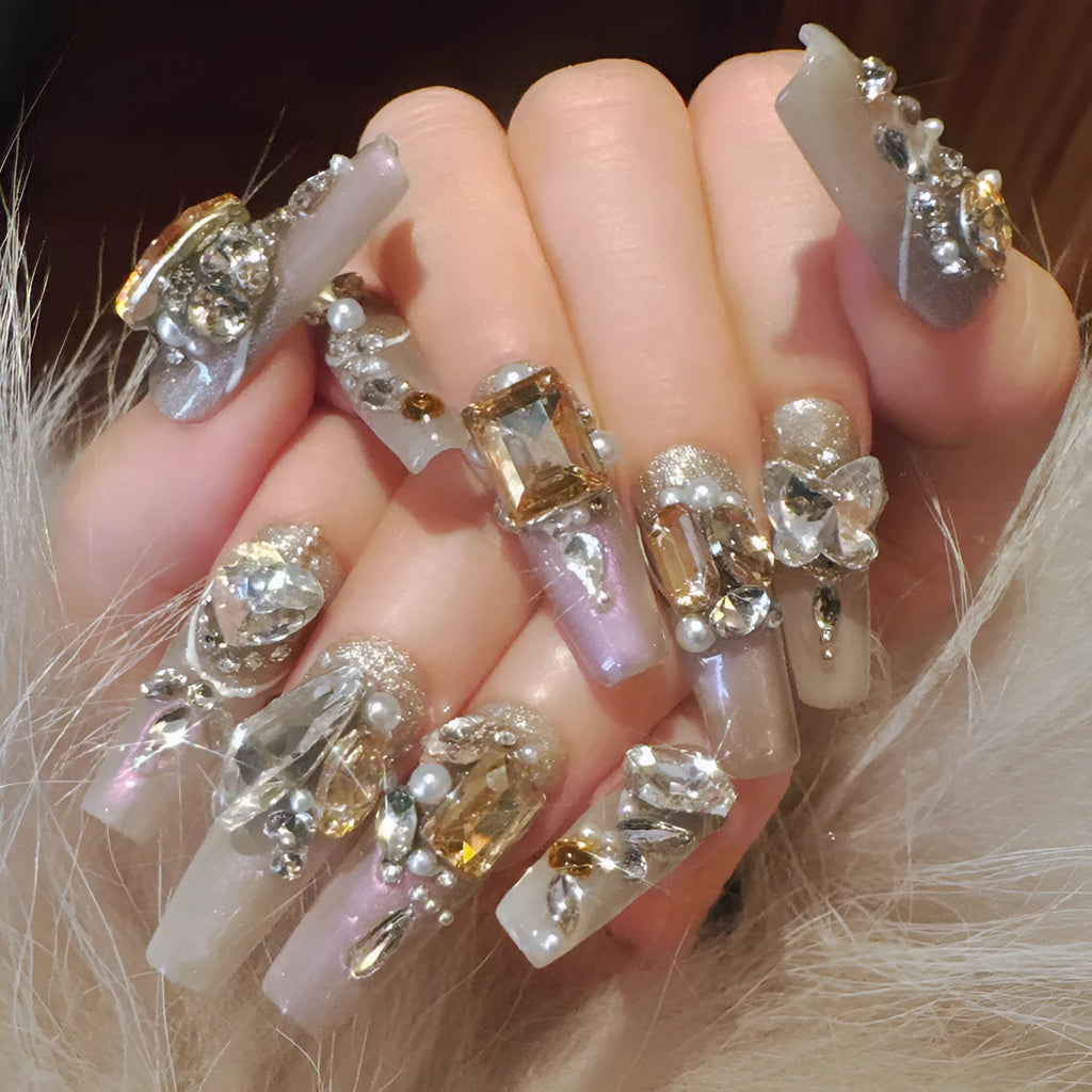 S number size luxury rhinestone false nail patches with jelly adhesive and tool options on card packaging.