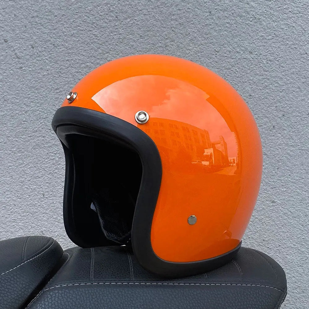 Retro-style glass fibre half motorcycle helmet shown in a selection of colours and prints.