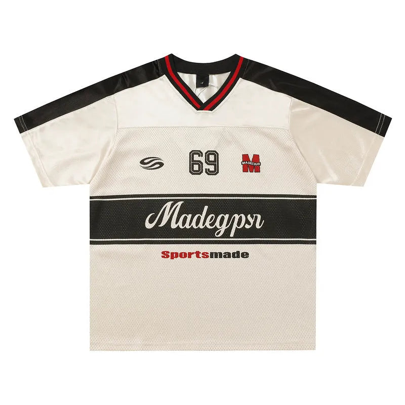 Apricot coloured loose fit sports V-neck jersey with short sleeves and a letter pattern.