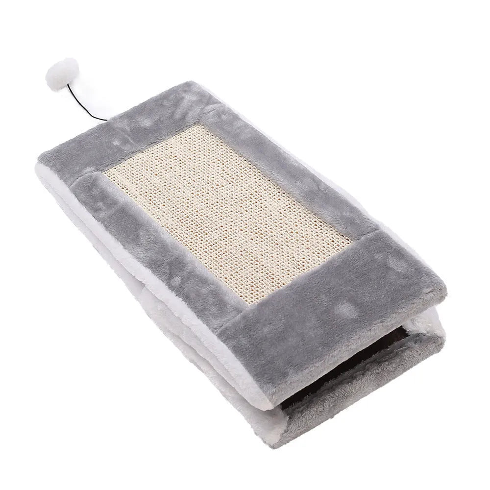Triangle-shaped grey and white cat nest with integrated sisal scratching post.