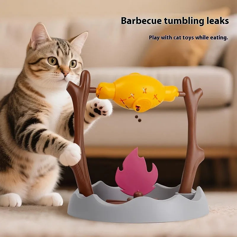 Barbecue style plastic tumbling cat food feeder toy on a white background.