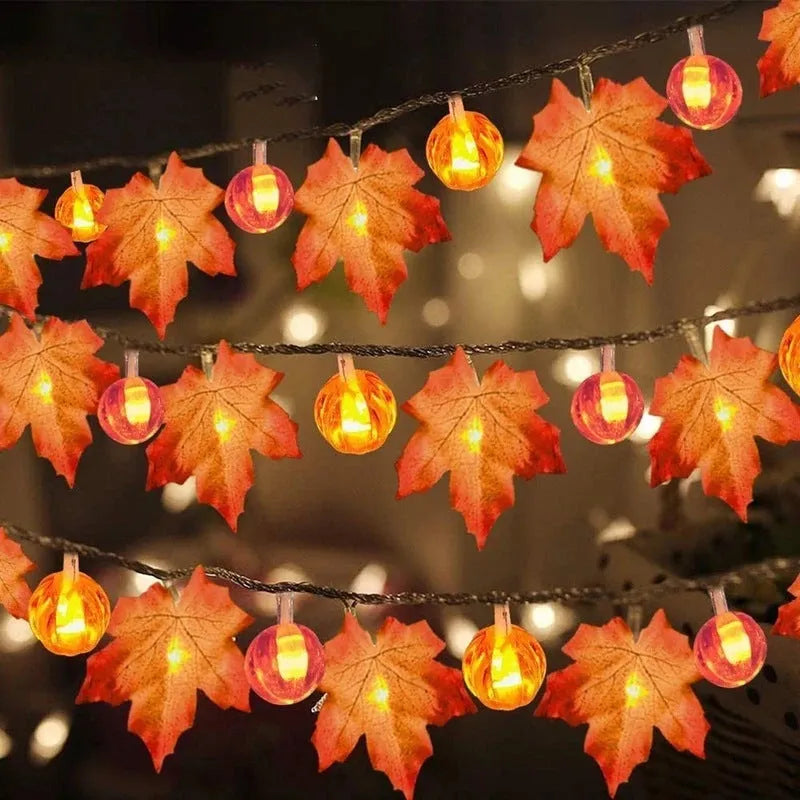 Halloween pumpkin and maple leaf LED light string on a dark background, with warm white 3000K glow