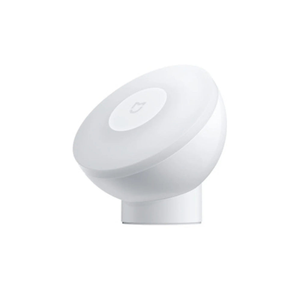 White Bluetooth induction bedside lamp with modern simple design on wooden nightstand