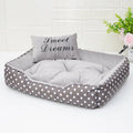 Polka dot printed square dog bed with matching pillow in grey, blue, pink, or rose red.