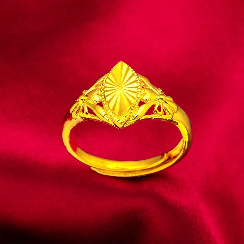 Gold electroplated brass ring with geometric open diamond flower design and textured surface