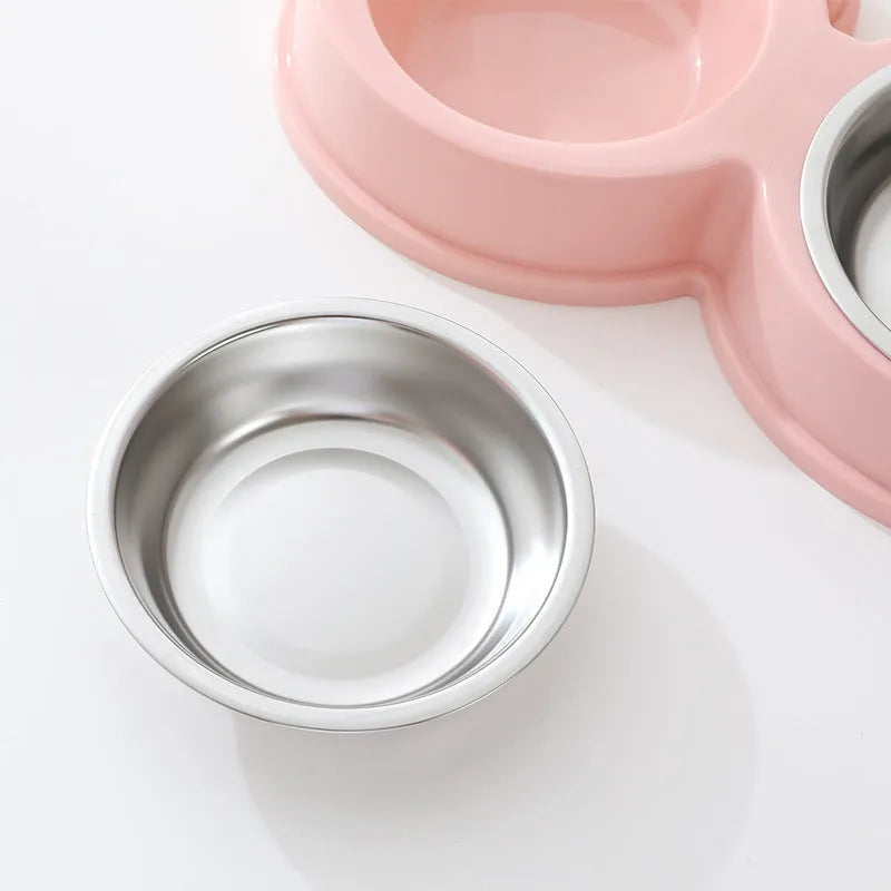 Stainless steel pet double bowl for cat and dog feeding in blue, green, and pink colours.
