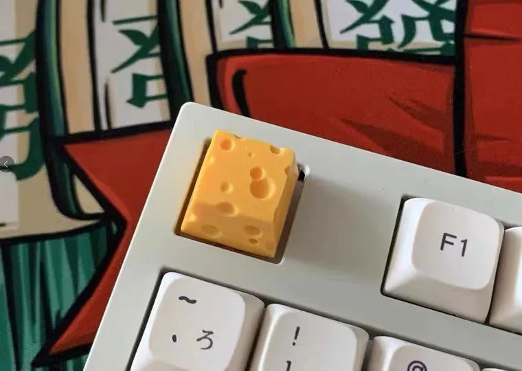 Yellow resin cheese design keycap for mechanical keyboards with Cherry MX switches.