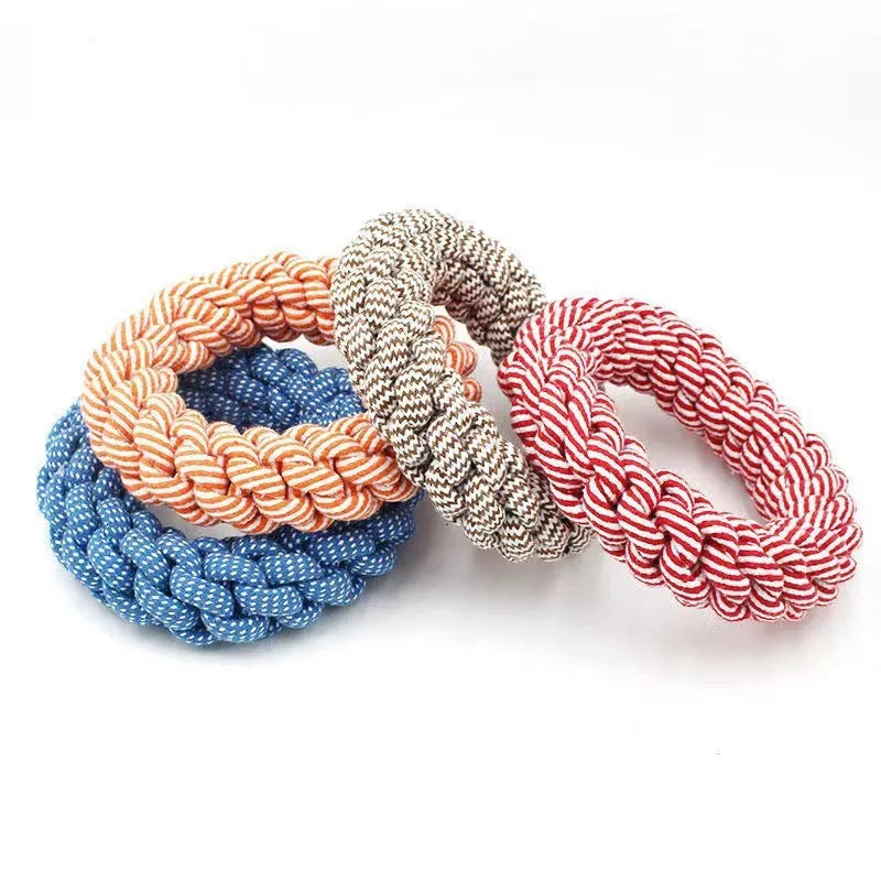 Cotton braided ring dog chew toy approximately 18cm in diameter with knot details