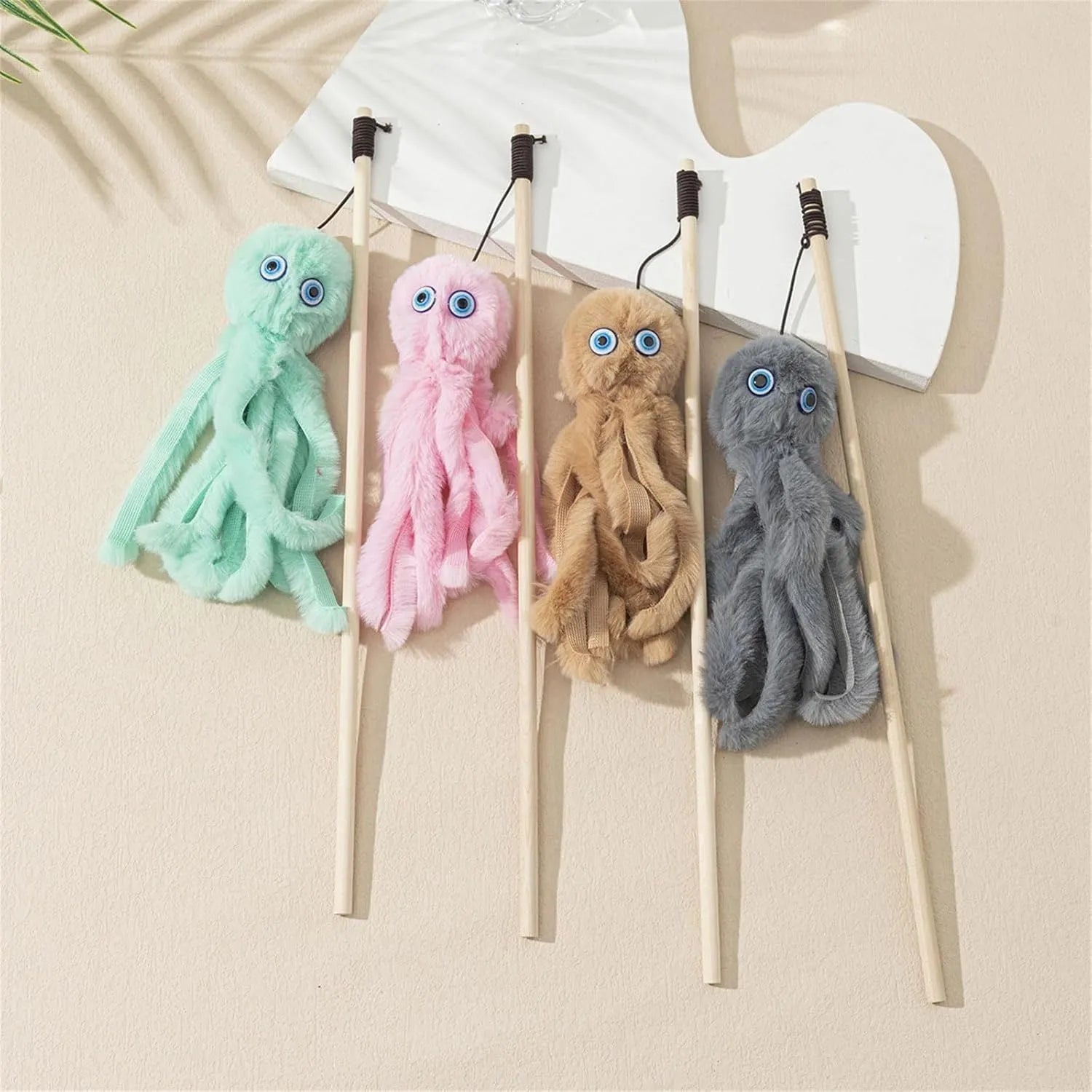 Colourful plush octopus cat toy attached to a long stick for interactive play.