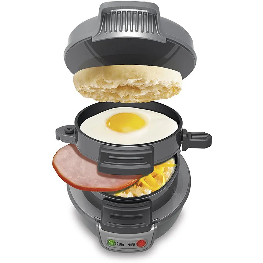Mechanical breakfast machine in silver grey with two baking trays and egg cooking ring