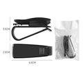 Black plastic multifunctional clip for car sunshades, holding sunglasses and a card.
