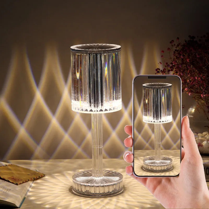 Modern crystal table lamp with a diamond-faceted shade on a metal stand, showing amber colour option.