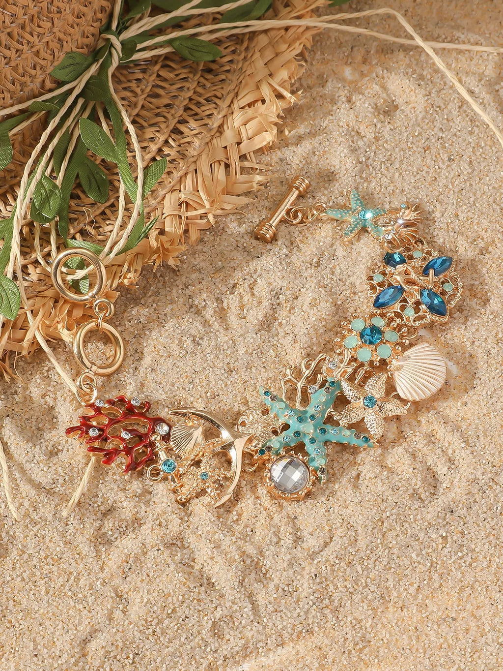 Alloy nautical bracelet with boat anchor charm, starfish detail, in turquoise, red, or blue.