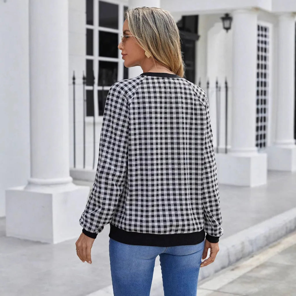 Black polyester pullover sweater with printed plaid and stripe pattern, long sleeves
