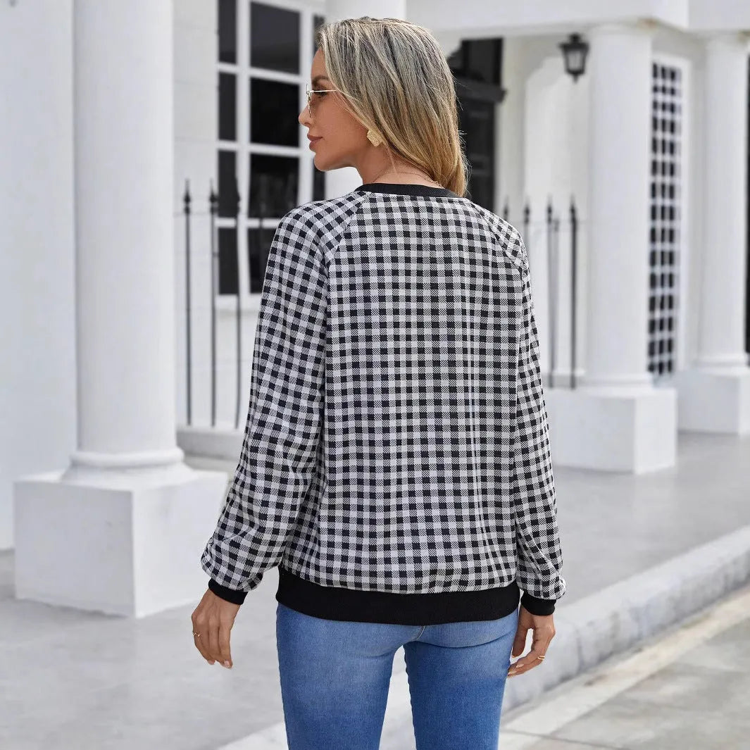 Black polyester pullover sweater with printed plaid and stripe pattern, long sleeves