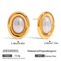 Small vintage-style pearl ear studs with a gold-tone finish on a stainless steel post.