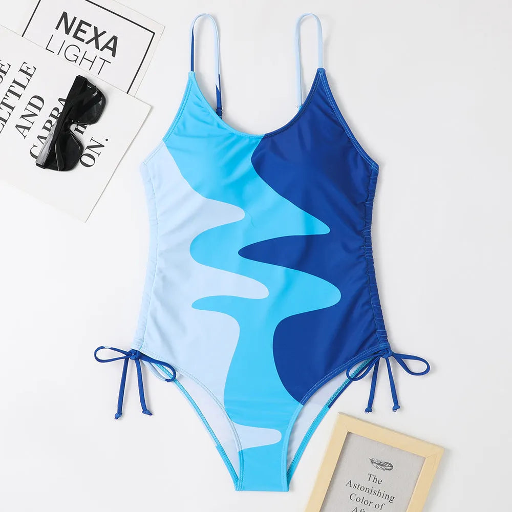 Blue women's sleeveless one-piece swimsuit with fixed swimming trunks on a mannequin