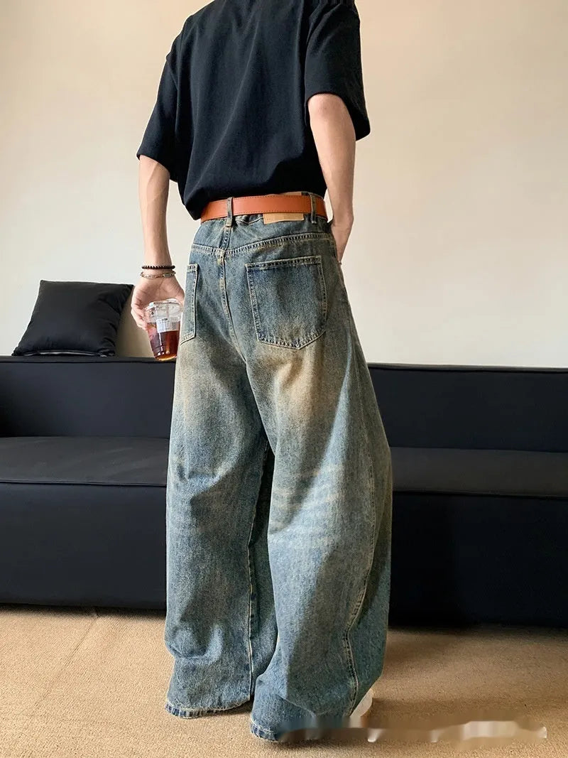 Men's retro blue distressed wide-leg denim jeans with micro-elastic fabric and zipper fly