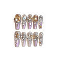 S number size luxury rhinestone false nail patches with jelly adhesive and tool options on card packaging.