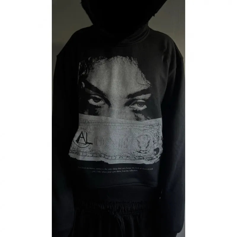 Black women's loose fit hooded sweater with dark printed cartoon pattern design