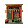 Small resin cartoon house night lamp ornament with a warm glow on a tabletop.