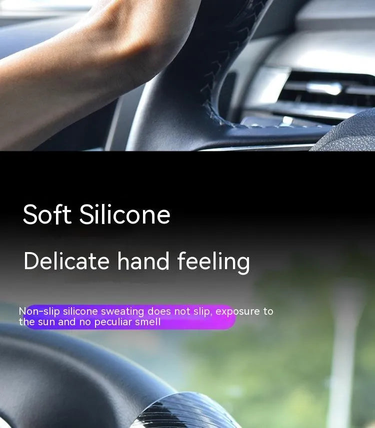 Black silicone steering wheel assist ball with metal bearing for single-handed driving aid.