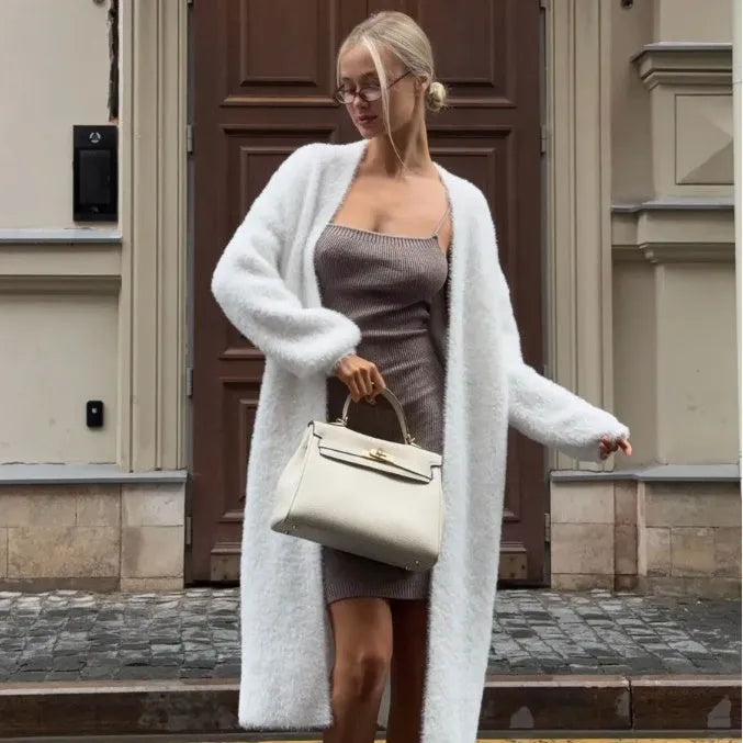 White long sleeve knit cardigan jacket on a hanger