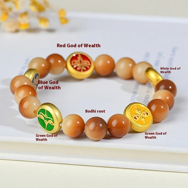 Yellow Bodhi seed bracelet with five directions geometry pattern on wooden surface