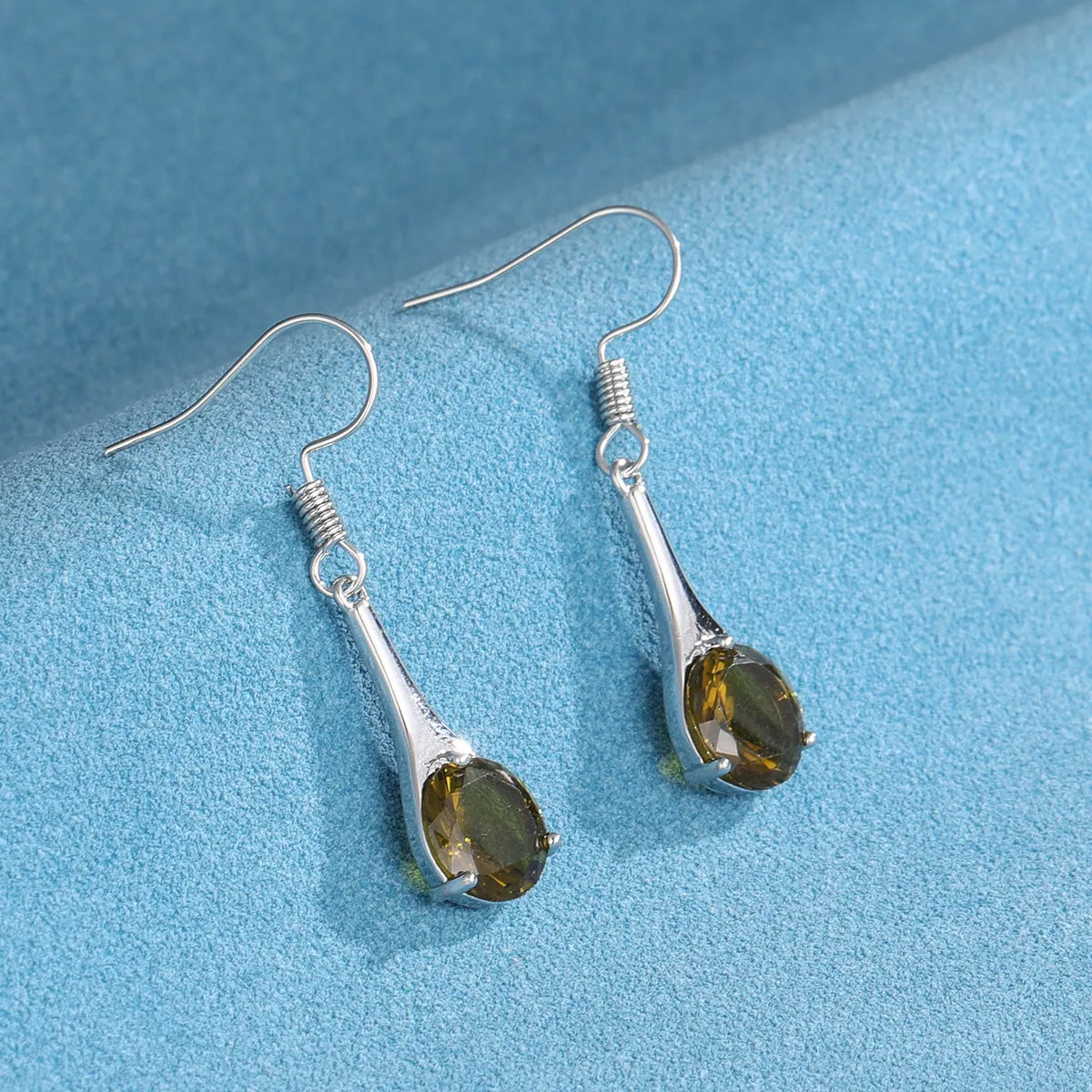 Olive green topaz drop earrings with water drop shape and minimalist retro design