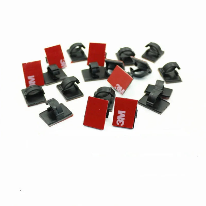 Black and white self-adhesive plastic buckles for organising flat car wiring cables