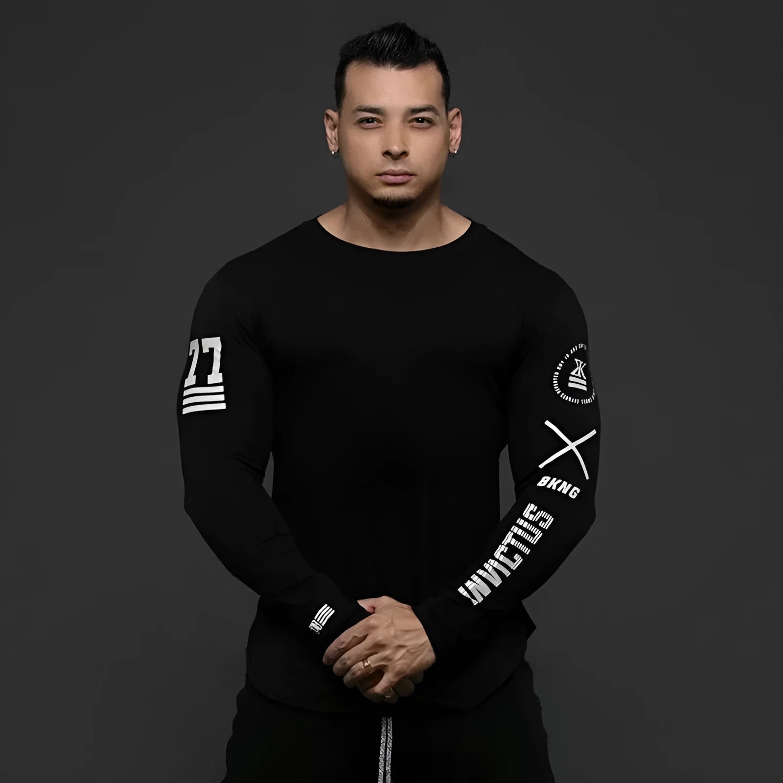Men's milk silk long sleeve round neck fitness top with letter print in black, shown on a dark background