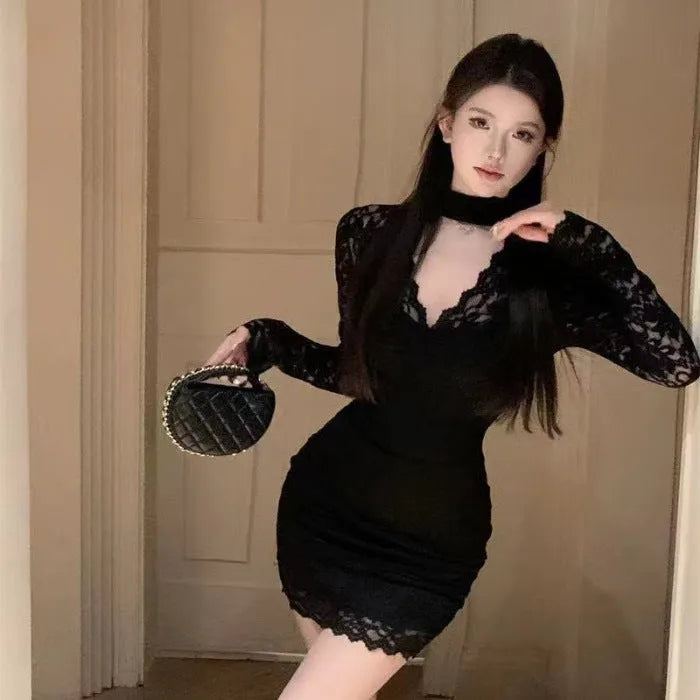Black halter neck A-line dress with a high waist and hip-wrapped design.