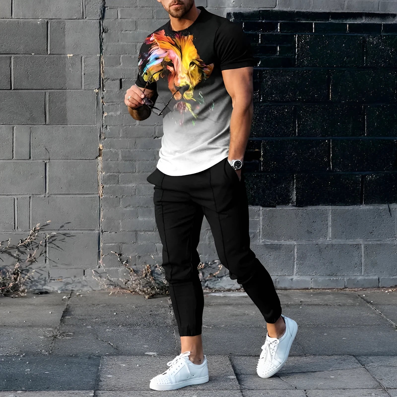 Man wearing a short sleeve round neck pullover and matching trousers from the polyester sports set.