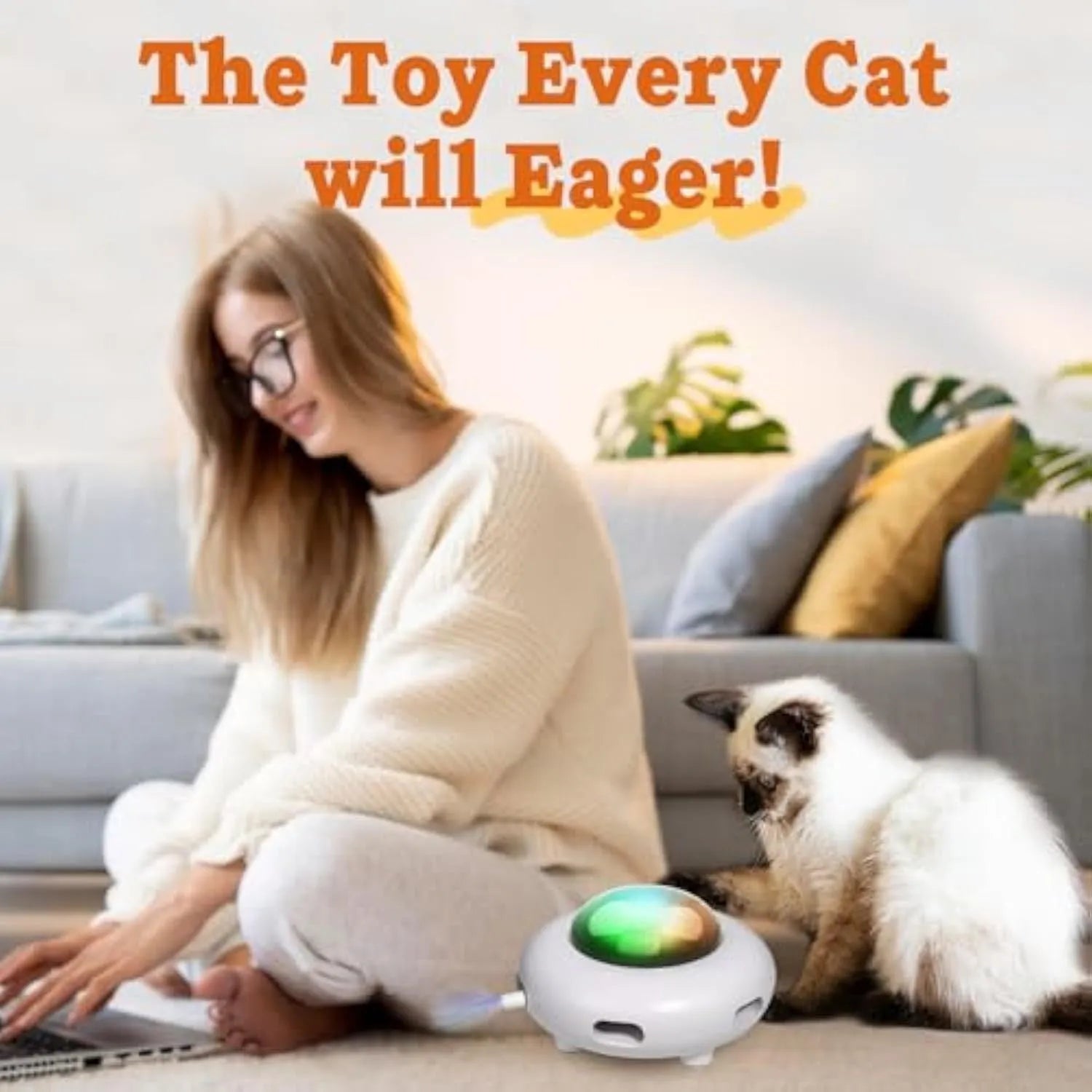 White automatic interactive cat toy with colourful feathers and LED lights on a home floor.