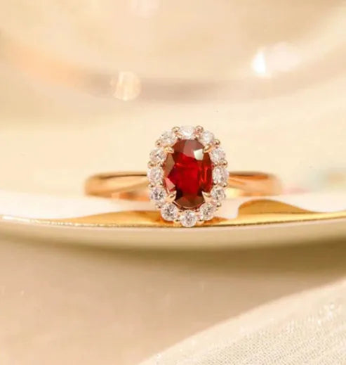Gold pigeon blood ruby sterling silver ring with floral design and artificial gemstone centre